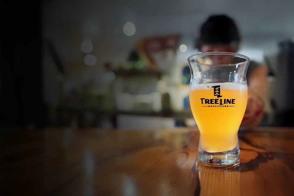 A pint in the taproom at Treeline Outfitters